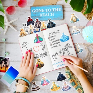 Detail of Lolita dress stickers on a beach themed scrapbooking scene with starfish