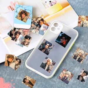 Detail view of a matte translucent iPhone case with anime boy stickers and decor