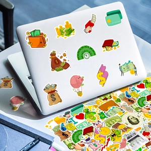 Macro detail of waterproof cartoon money stickers on a silver laptop surface