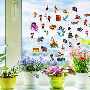 Pirate stickers with octopus and ships applied to a window glass in a home setting