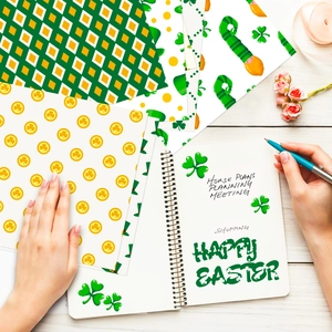 Detailed flat lay of St. Patrick's Day patterned craft paper with clover and polka dot designs