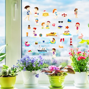 Close-up of summer beach theme jelly stickers on a glass window for early education