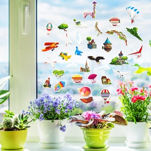Detail of colorful cartoon window stickers with hot air balloons and castle on glass
