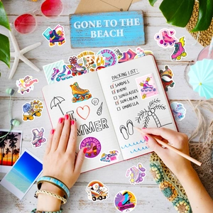 Flat lay of colorful retro roller skate stickers with beach themed summer decorations