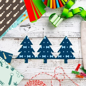 DIY Christmas scrapbook paper set with blue bow patterns and festive craft accessories