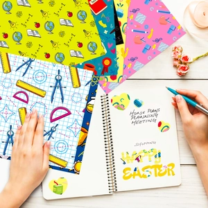 Macro shot of Teachers Day themed decorative paper with math and stationery patterns