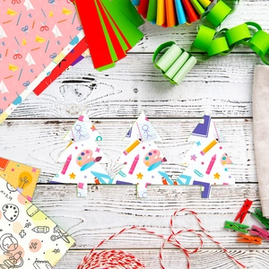 Flat lay of teacher's day school stationery themed paper crafts and colorful paper cutouts