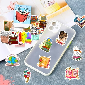 Detail of colorful book themed stickers applied on a phone case and杂志 surface decoration
