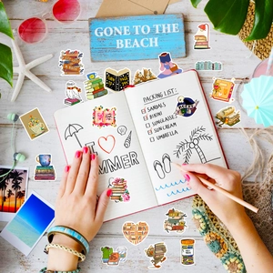 Detail of bookworm stickers on planner with summer beach elements and reading quotes