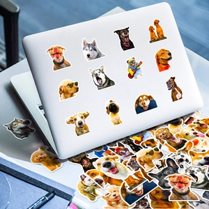 Waterproof dog stickers on laptop cover featuring husky and golden retriever designs