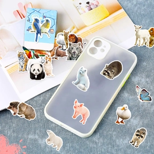 Detailed realistic animal stickers displayed on phone case and notebook pages