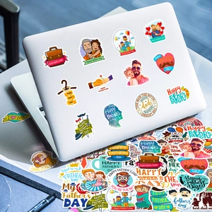 Detailed view of Father's Day cartoon stickers applied on a laptop and stacked collection