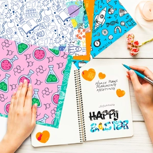 Close-up of science themed decorative scrapbooking paper with formulas and vintage motifs