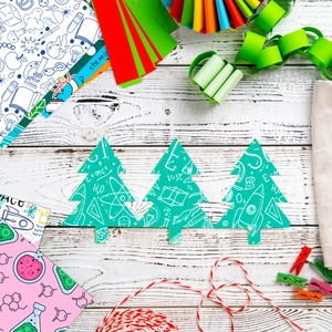 Detailed science-themed tree-shaped stickers with formulas on a colorful craft background