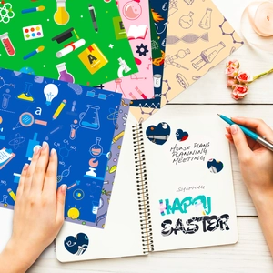Detailed close-up of science-themed decorative paper with chemistry flasks and formulas