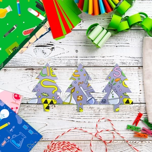 Macro view of Christmas tree-shaped science theme scrapbooking paper for DIY decoration