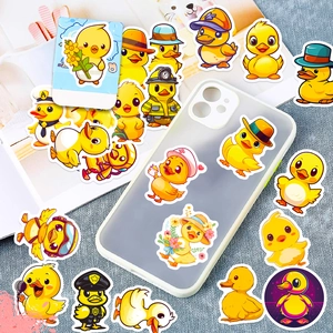 Close-up showing various yellow duck stickers on a phone case and patterned surface