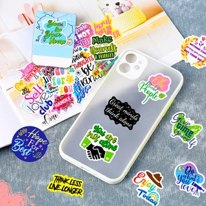 Close-up of waterproof inspirational quote stickers on a transparent phone case
