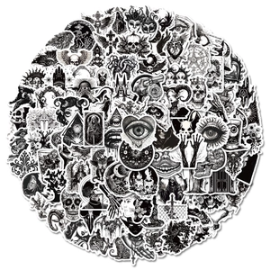 Close-up of assorted black and white Gothic punk stickers with skull and tarot motifs