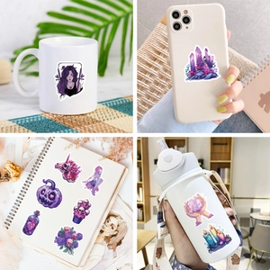 Purple gothic stickers shown on mug, phone case, and notebook for creative decoration