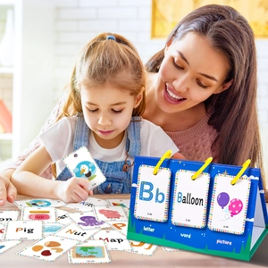 Close-up of children's English alphabet learning flip cards with colorful animal illustrations
