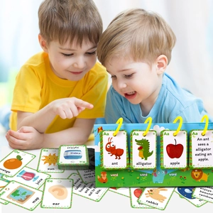 Detail view of children learning with interactive English flashcards on a green desktop stand