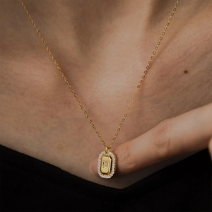 Gold Taurus zodiac necklace with white zircon pavé pendant on sterling silver base