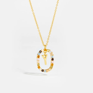 Macro detail of 925 sterling silver Y letter necklace with colorful zircon stones