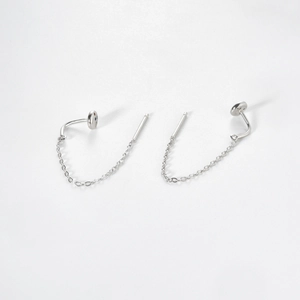 Detail of S925 sterling silver drop earrings with dainty chains and minimalist studs