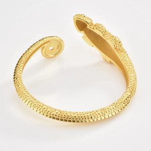 Close-up of S925 engraved stamp and gold plated lizard skin texture on adjustable bangle
