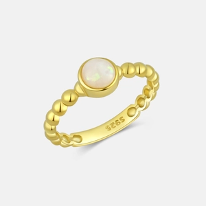 Detail of S925 sterling silver stamp on gold chain ring with opal stone inlay