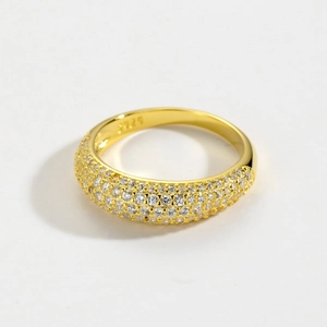 Detailed close-up of S925 sterling silver stamp on golden multi-row iced-out ring