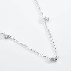 Detailed view of S925 silver necklace with three brilliant zircon inlays on white background
