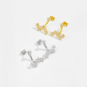 Boucles d'oreilles étoiles en or et argent serties de zircons scintillants