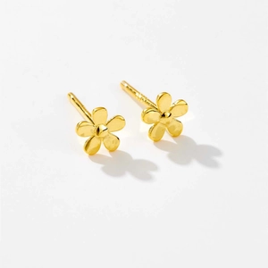 Detailed macro view of S925 sterling silver gold-plated mini five-petal flower earrings