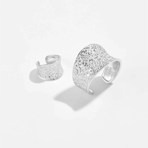Detail shot of hammered S925 sterling silver texture and official hallmark on the rings