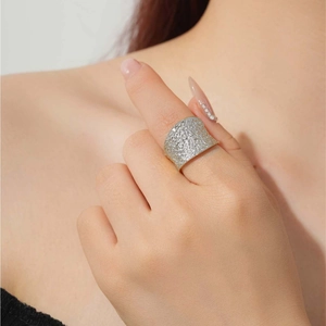 Classic S925 sterling silver wide band ring with irregular hammered texture on model