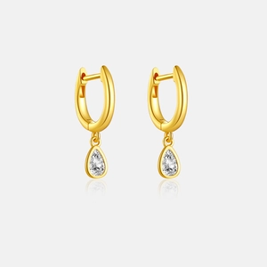 Detailed macro view of S925 silver gold-plated hoop earrings with pear-cut zircon drops