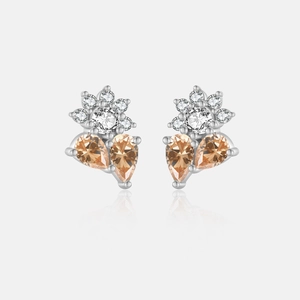 Detalle de pendientes de flor en plata s925 con piedras preciosas naranja champán
