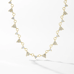 Minimalist S925 silver necklace with golden triangular gemstone pendants on white background