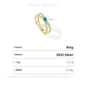 Detailed view of S925 silver ring featuring a pear-cut blue stone and cross-wrap design