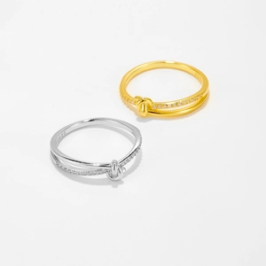 Detailed macro of S925 sterling silver knotted double rings with micro-pave zirconia
