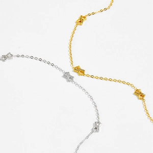 Minimalistische Armbänder aus 925er Silber und Gold mit X-Anhängern und Steinen