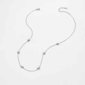 Detail of S925 silver necklace featuring six daisy pendants with clear zircon stones