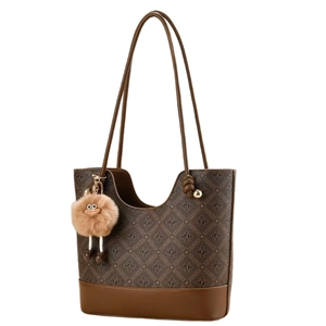 Classic monogram tote bag in brown leather with a cute plush daisy charm and shoulder strap