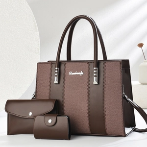 Three-piece dark coffee tote bag set with textured fabric stitching and metal logo