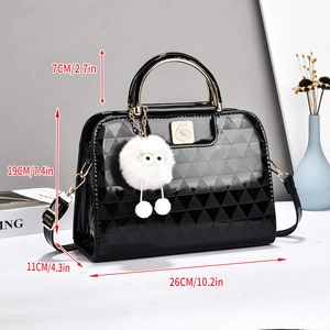 Detail showing dimensions of black glossy tote bag with geometric texture and plush charm