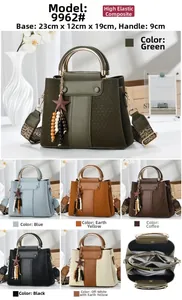 Detail view of stylish color-block handbag showing compact 23x12x19cm size and interior compartments