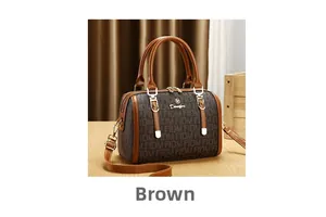 Detail of Boston handbag showing brown PVC monogram pattern and leather straps