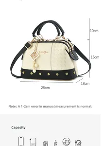 Detail showing handbag dimensions of 25x13x15cm with elegant pearl charm and gold studs